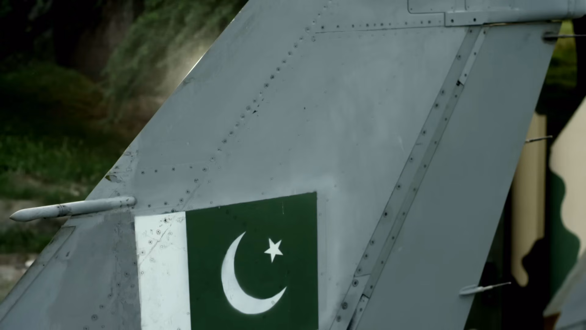 Pakistan flag painted on the tail fin of a Pakistan Air Force fighter aircraft.